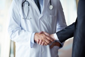 Doctor handshake with a patient